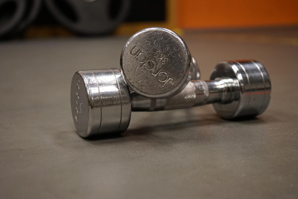 list_of_dumbell_exercises_002 a set of steel dumbbells for working out