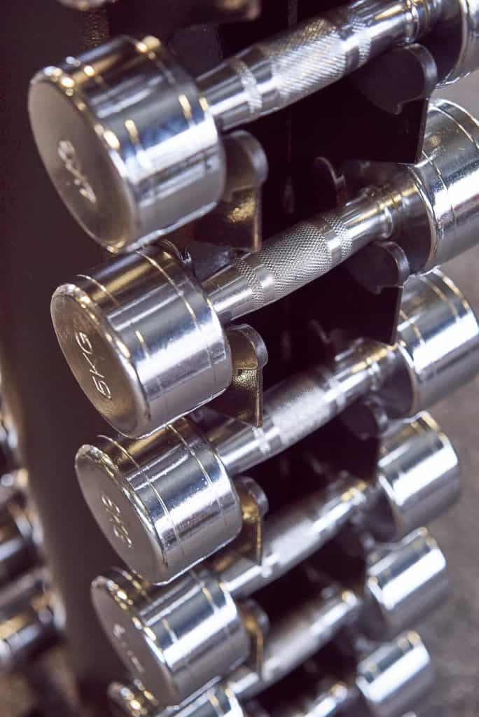 A row of dumbbells stacked upright