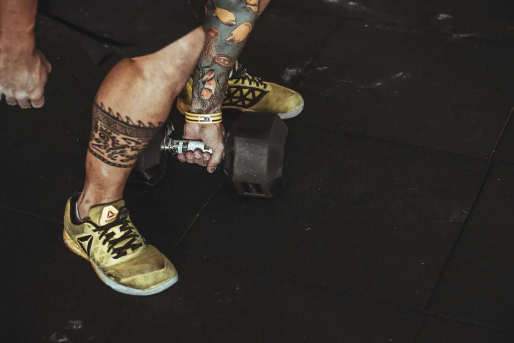 Man lifting a dumbbell with one hand