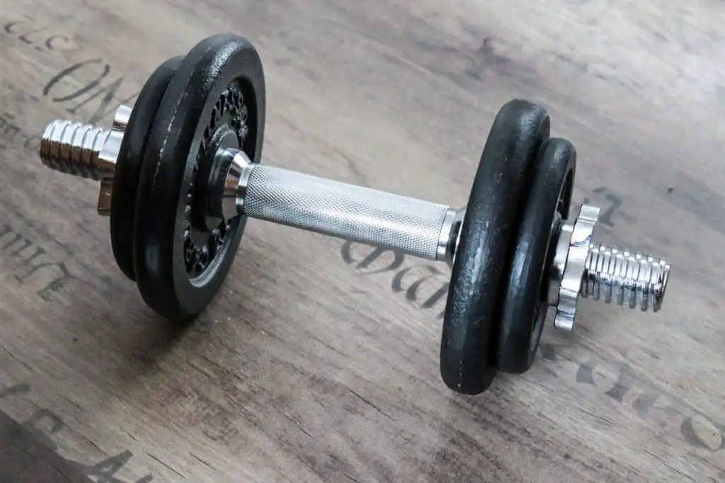 Dumbbell placed on wooden surface