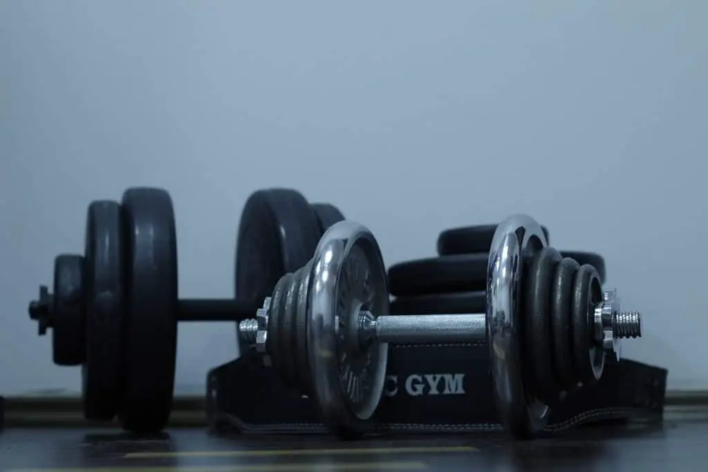 Two different weight options of an adjustable dumbbell