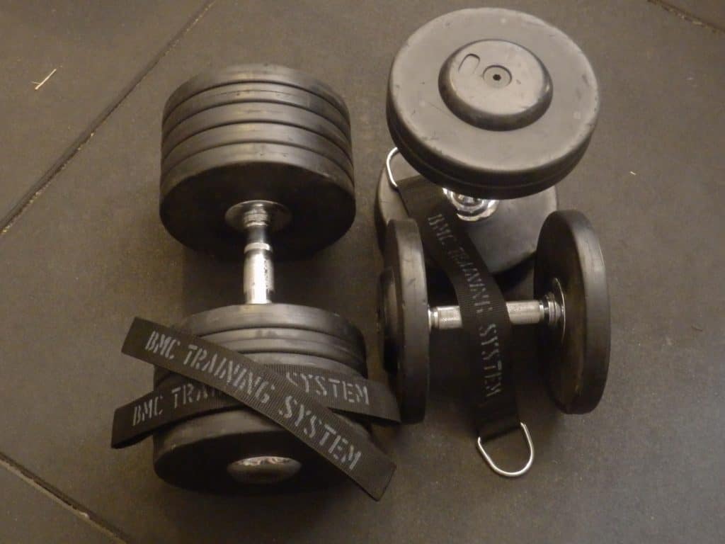 Three dumbbells in different weight sizes