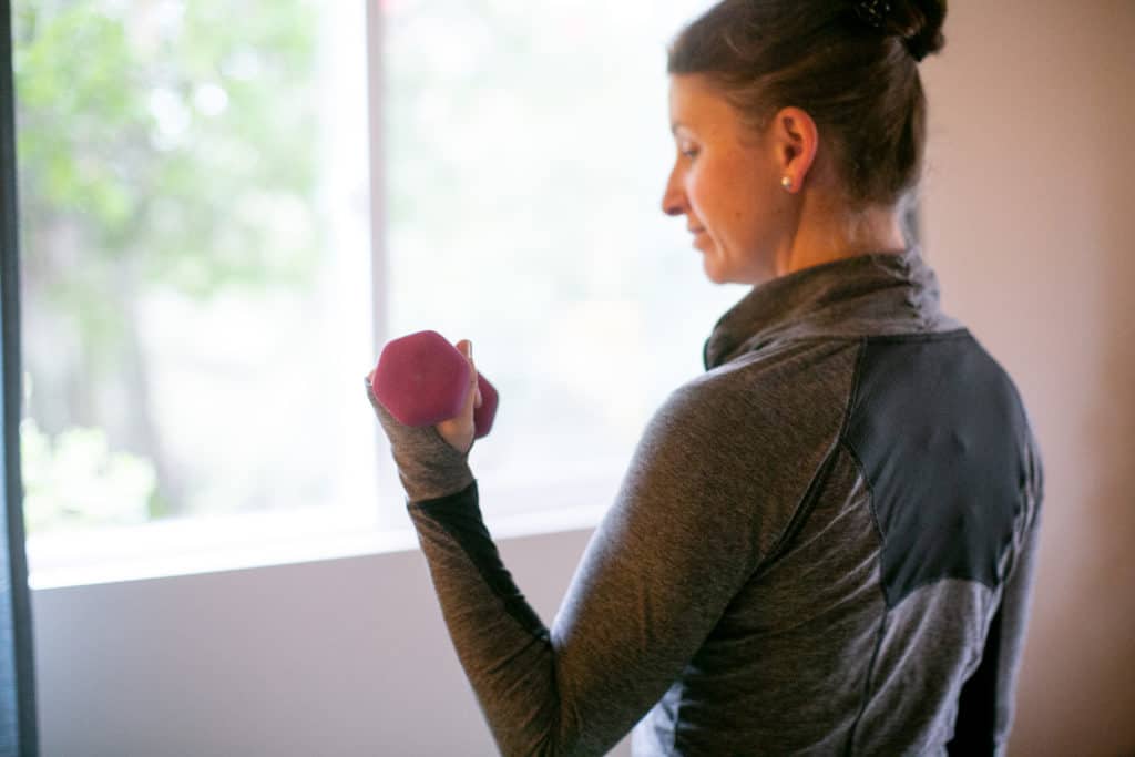 Woman lifting a dumbbell with one hand
