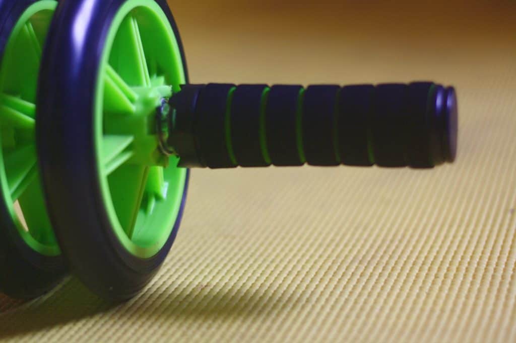 A black and green colored ab roller