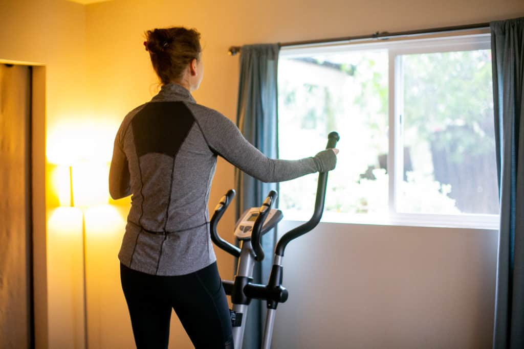 Working out at home in a spare room with with window and artificial lighting