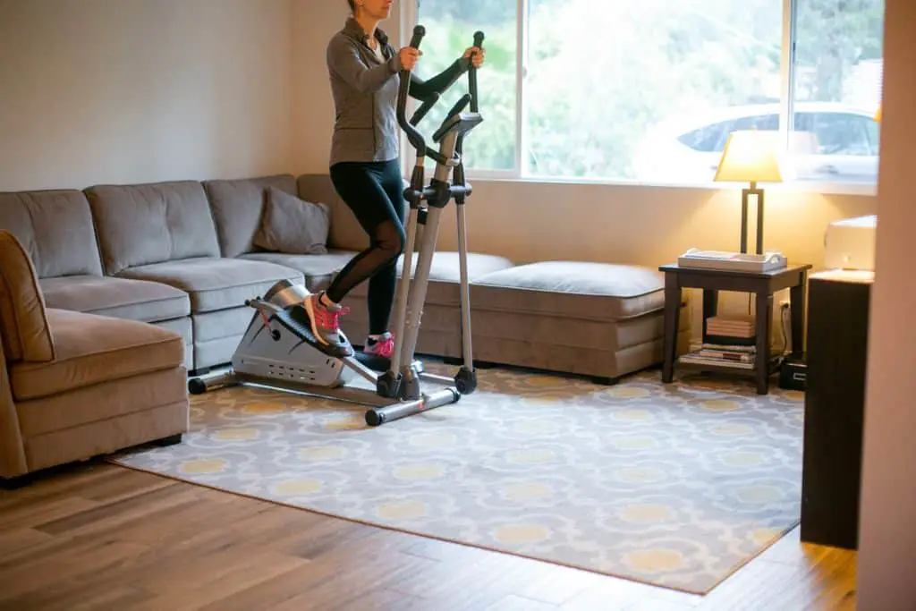 Woman using her fitness equipment at home