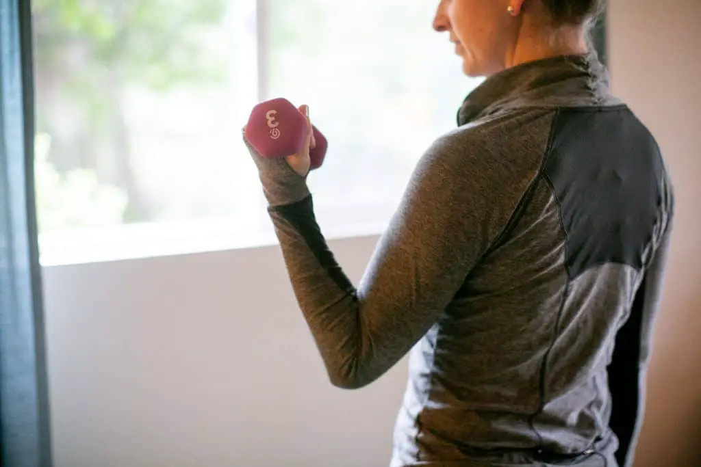 Woman lifting a dumbbell with one hand
