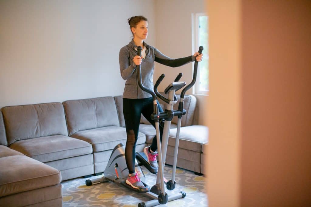 Woman using a fitness equipment at home