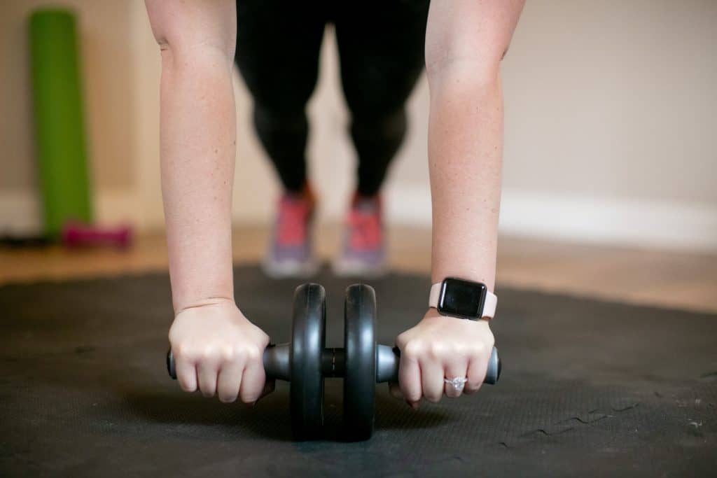 Woman using an ab roller