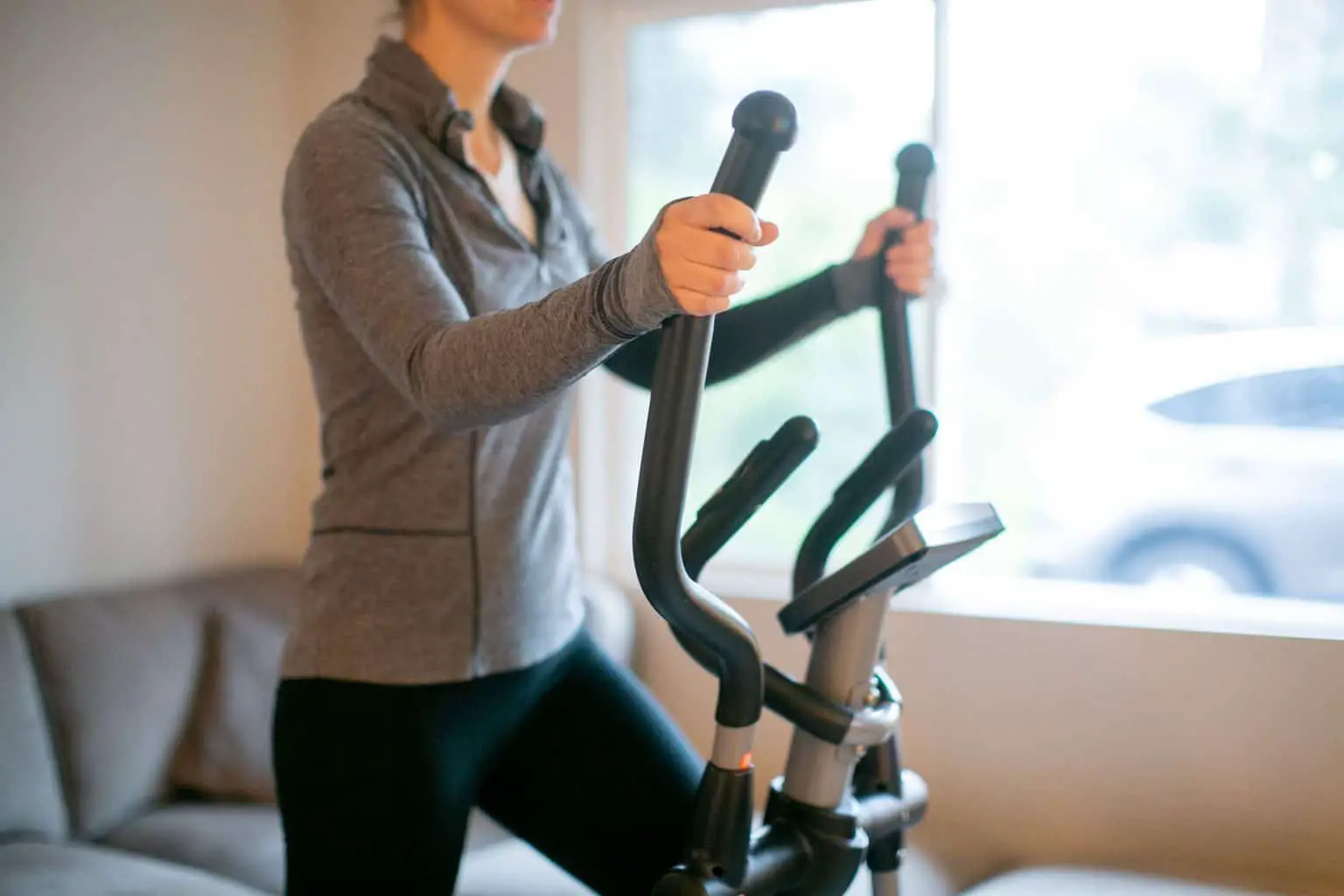 Woman using her fitness equipment at home