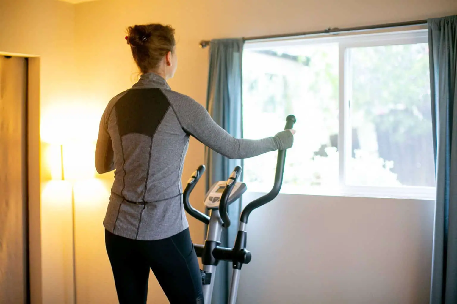 Woman using a fitness equipment at home
