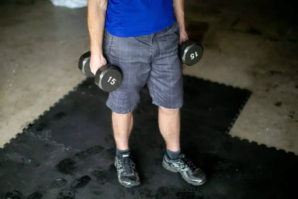 Man holding dumbbells with each hand