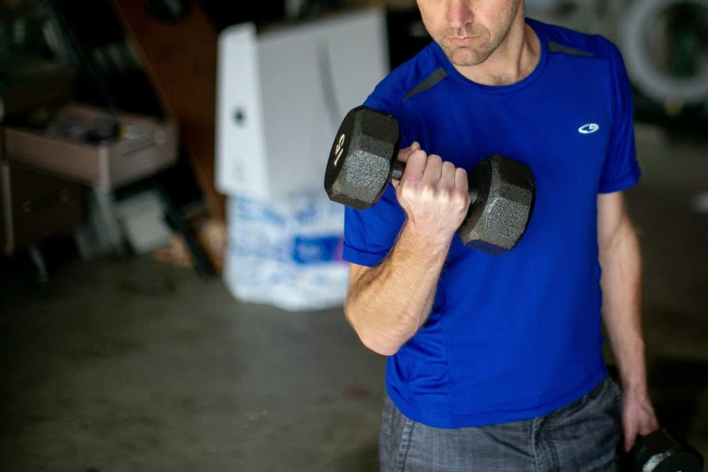 Man lifting a dumbbell with one hand