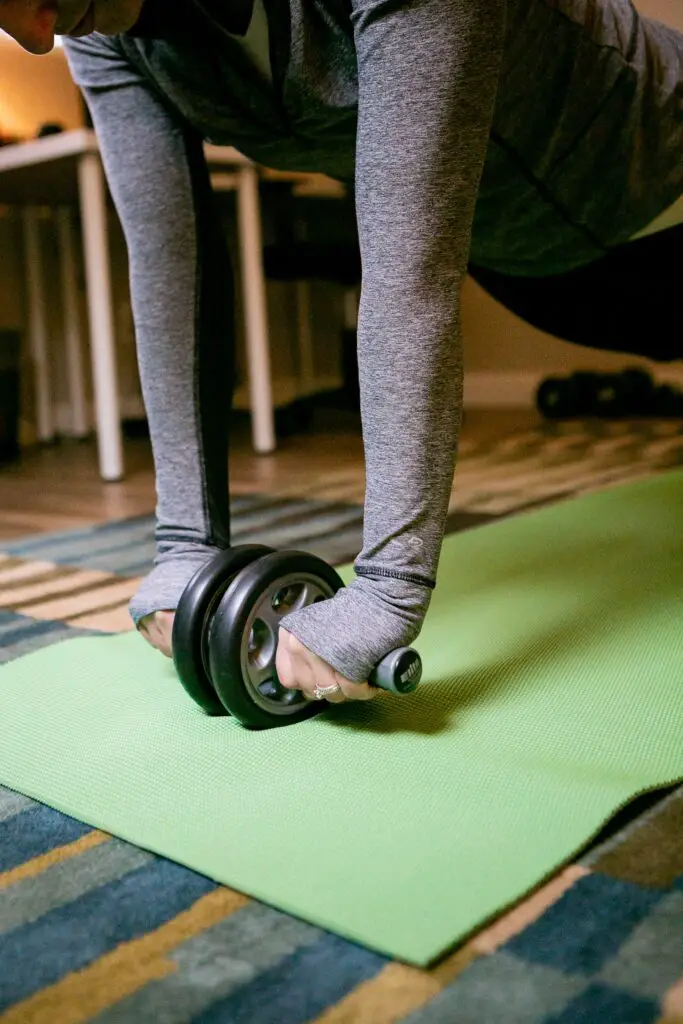 Person using a newly bought ab roller from the market