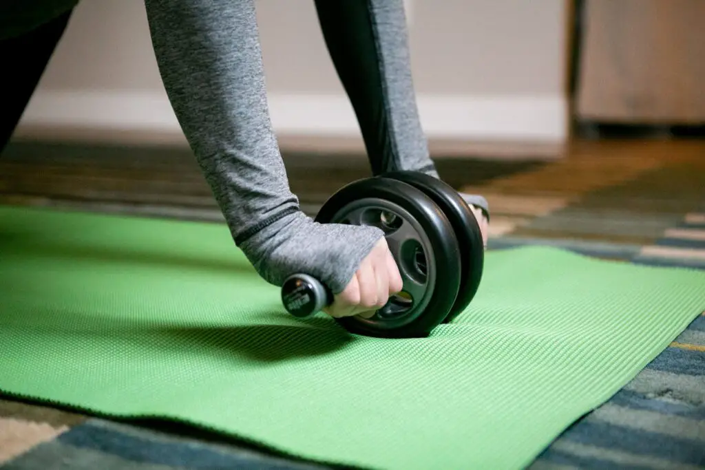 Close up of a person using an ab roller properly