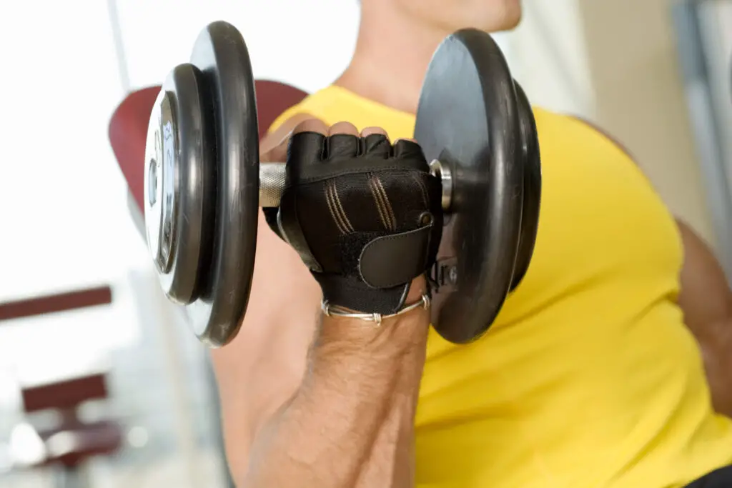 Close-up of a man using a dumbbell