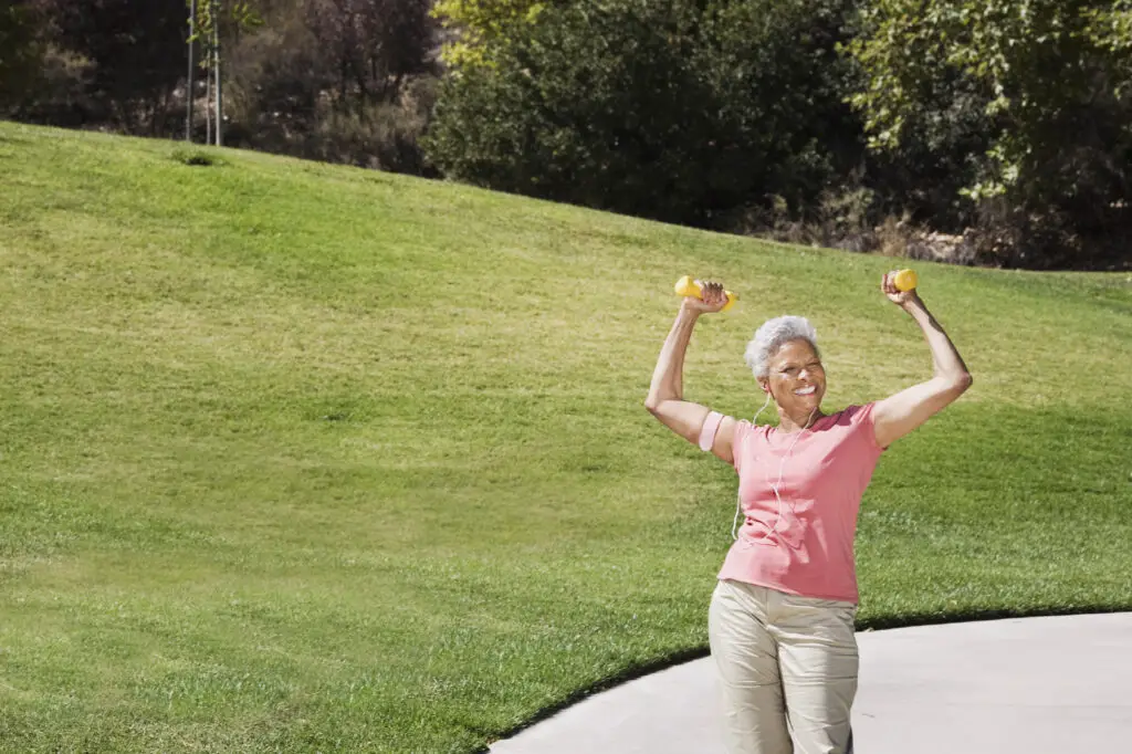 Elderly woman doing bicep dumbbell exercises