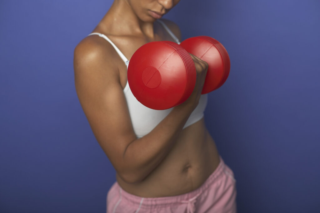 Woman lifting dumbbells
