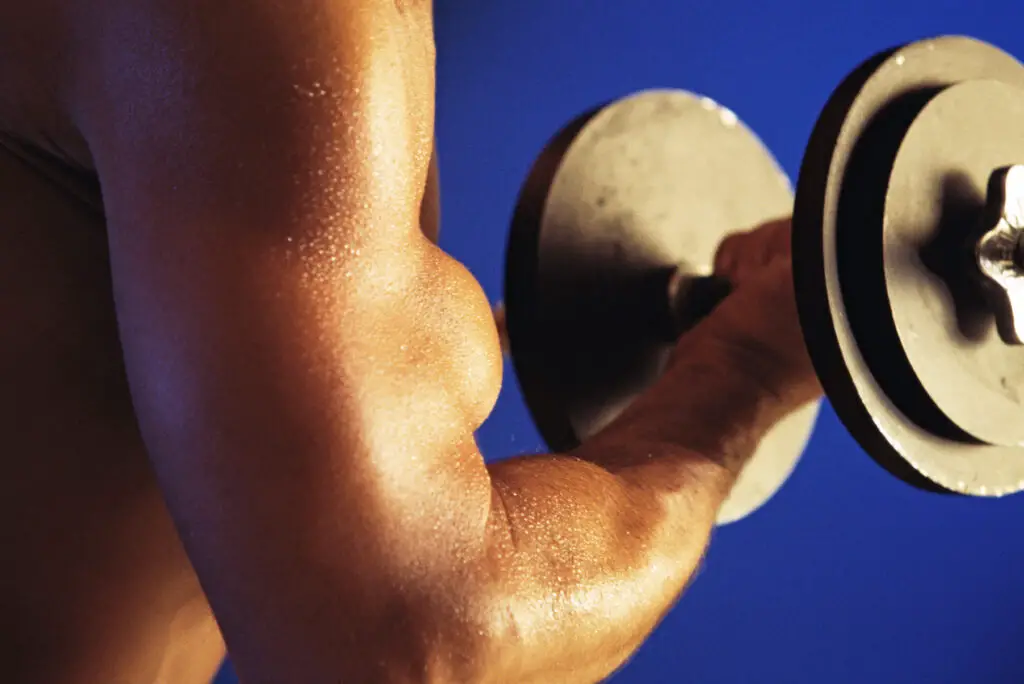 Cropped shot of man doing dumbbell curls
