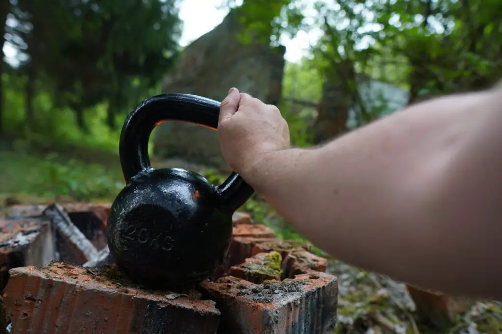 Close up of a man trying to see what does a kettlebell look like