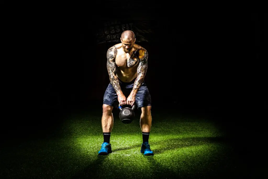 Man about to do a kettlebell swing