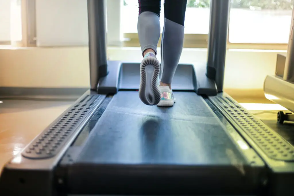 Person using a compact treadmill