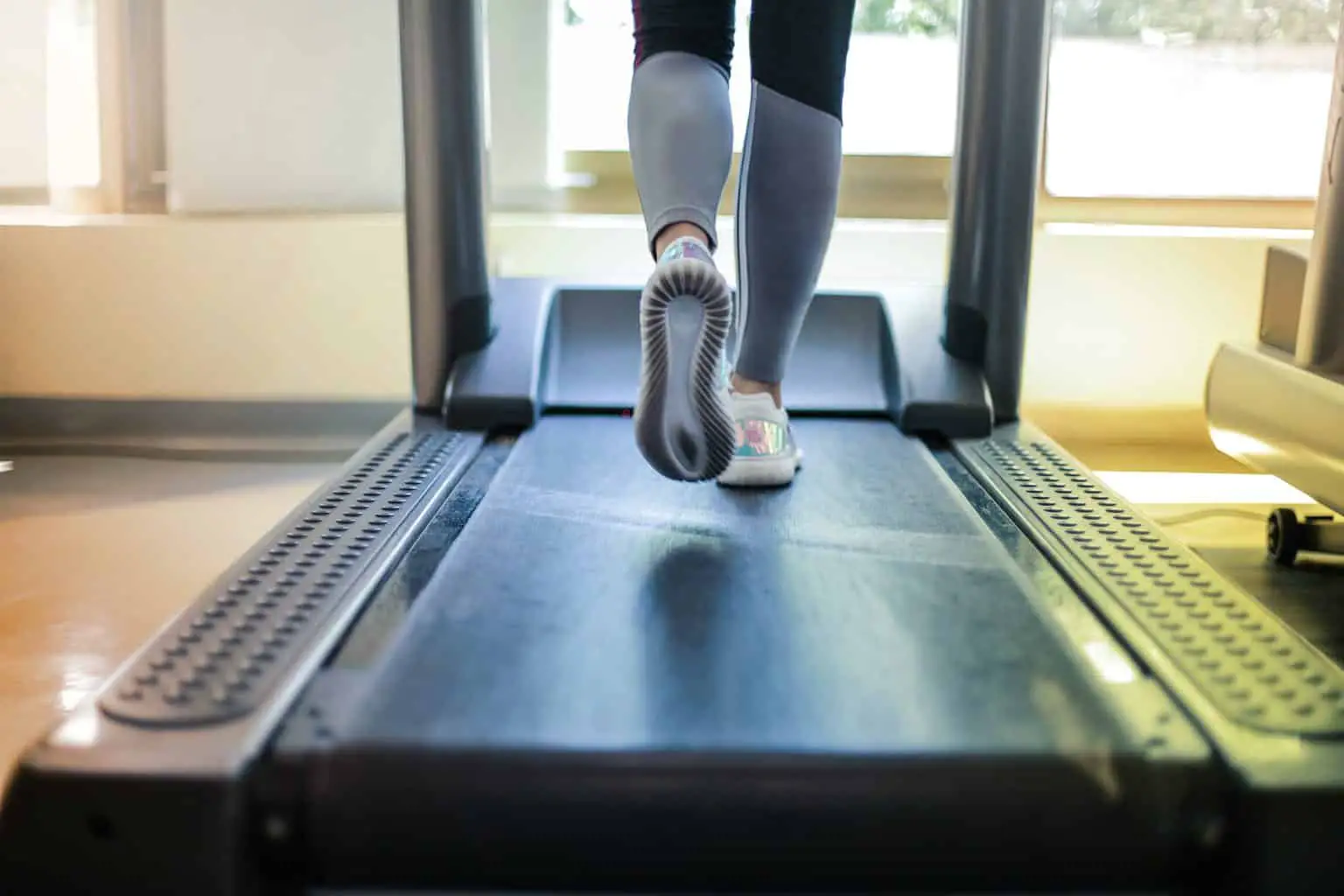 Person using a compact treadmill