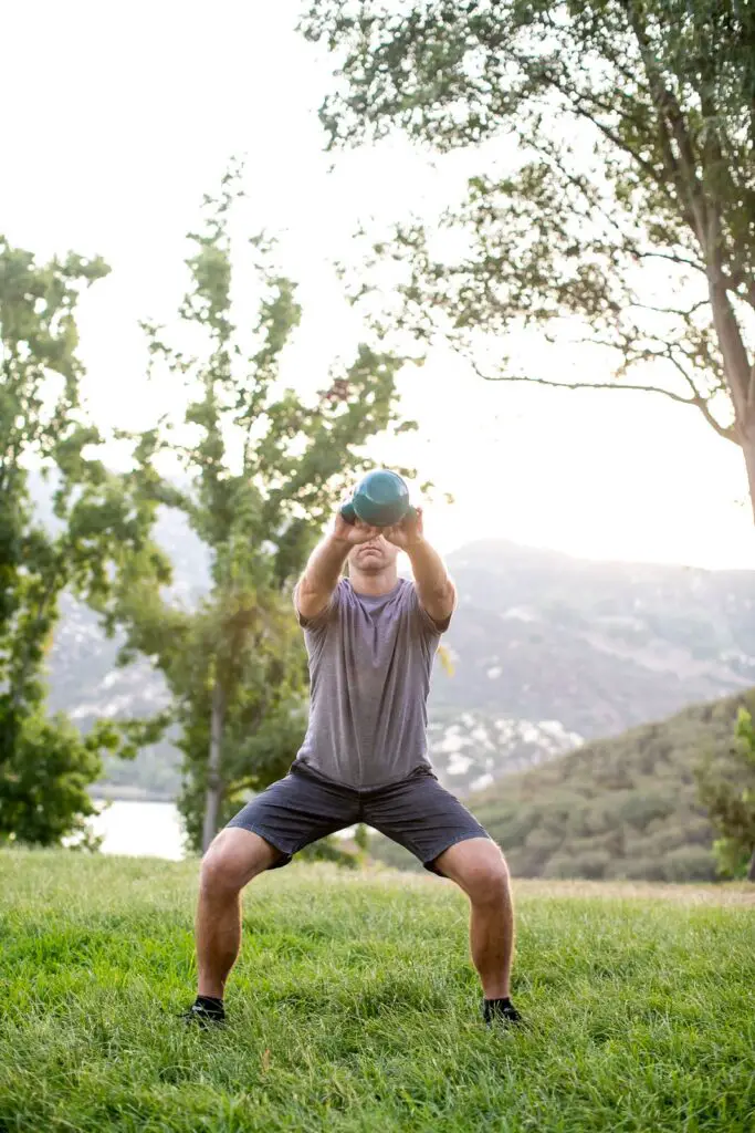 Man performing a kettlebell swing