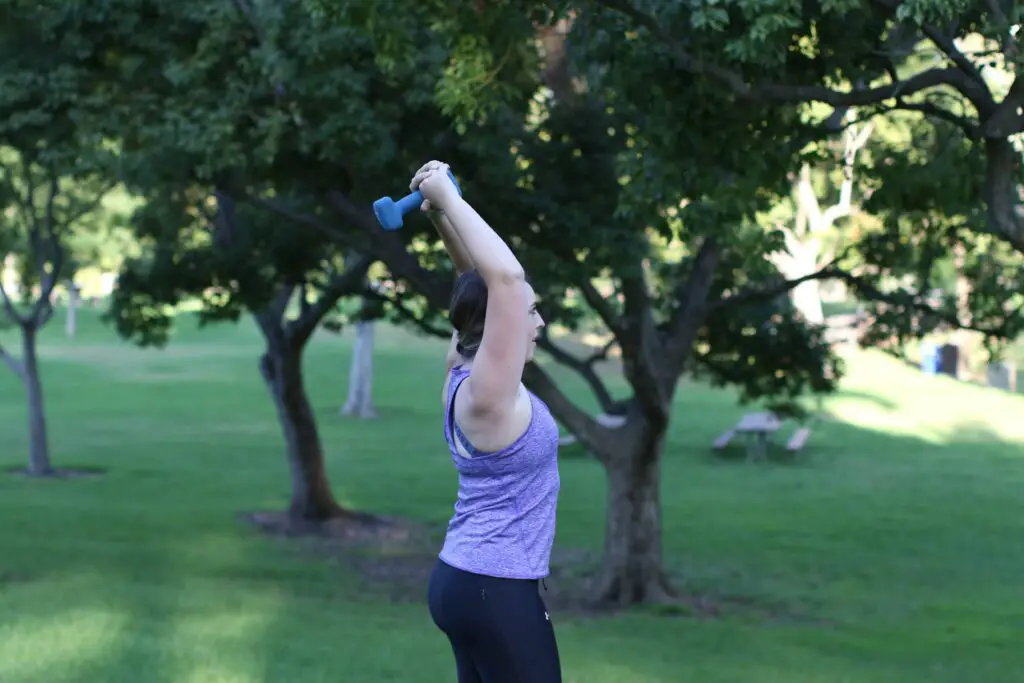Woman lifting a dumbbell over her head