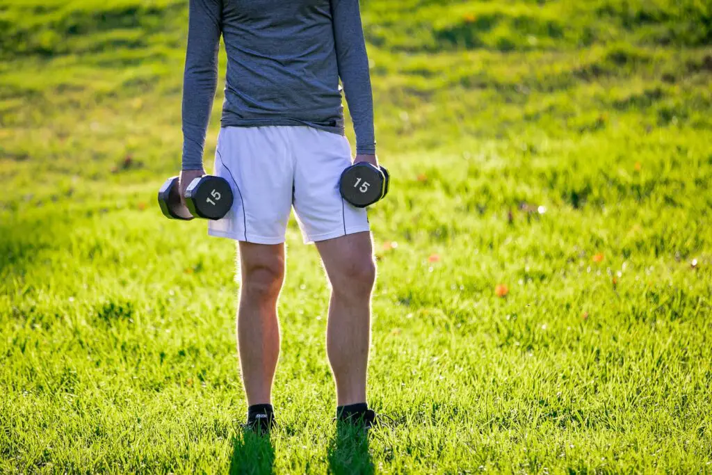 Man holding a dumbbell with each hands
