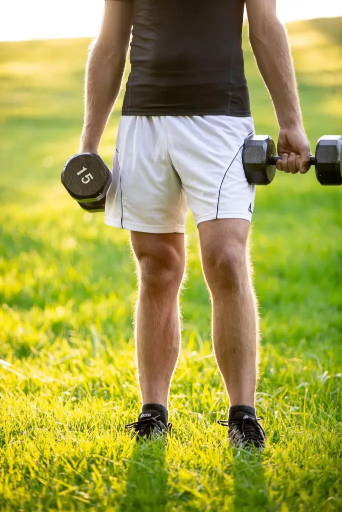 Man holding a dumbbell with each hands