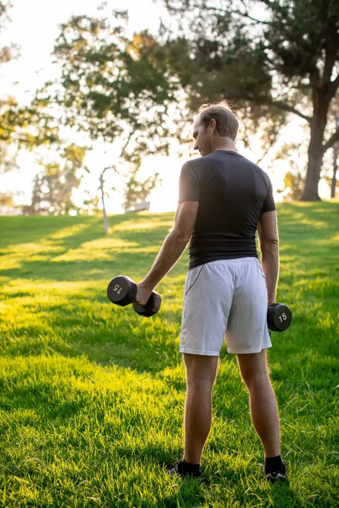 Man holding a dumbbell with each hands