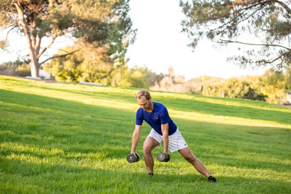 Man performing dumbbell exercises