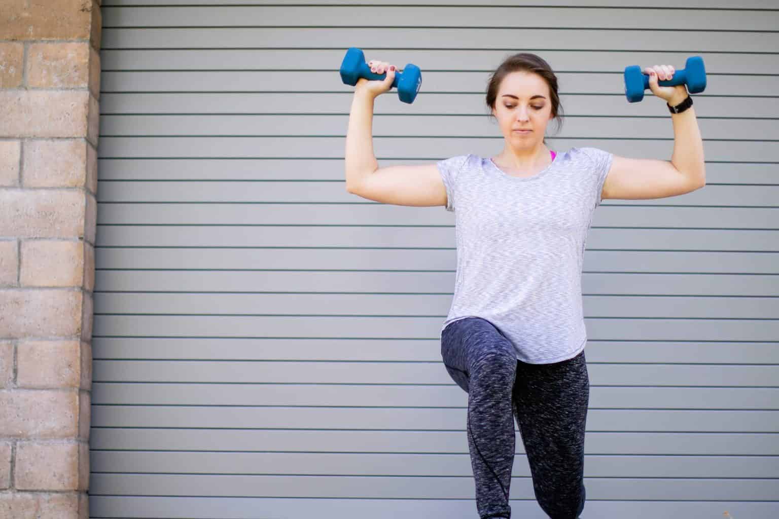 Woman performing dumbbell flys