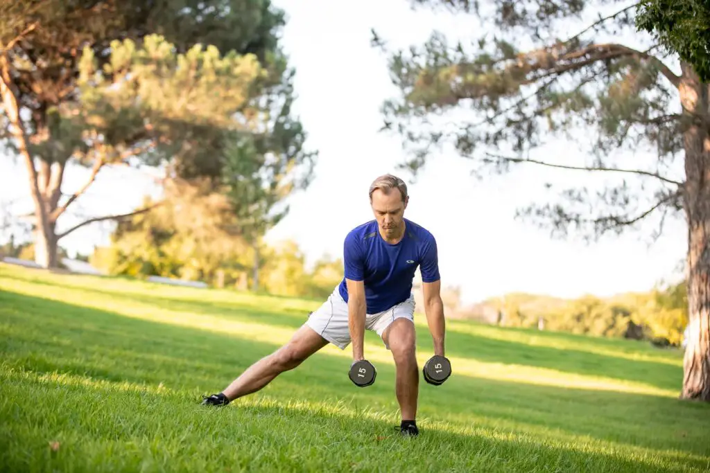 Man performing dumbbell exercises