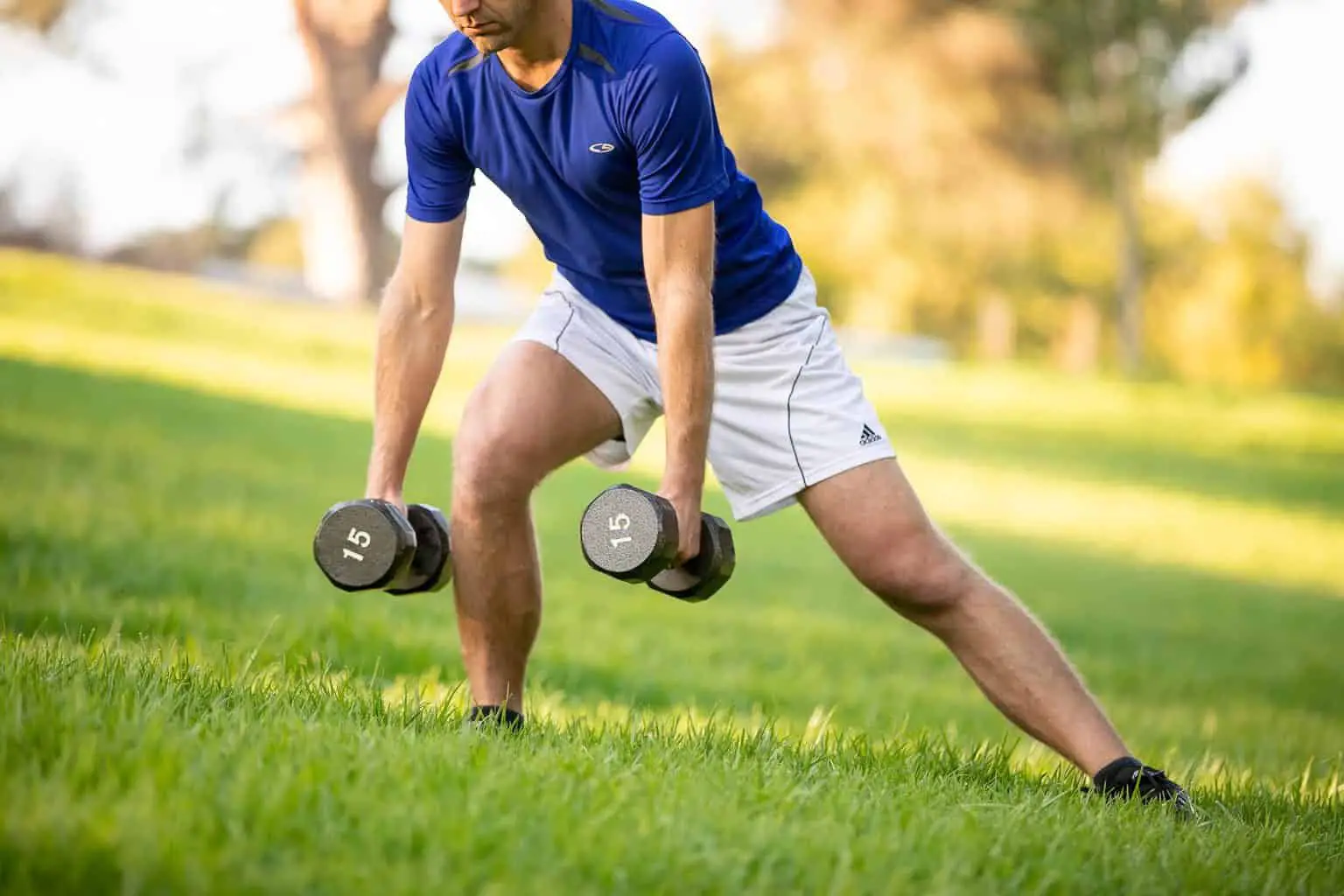 Close up of man performing dumbbell exercises