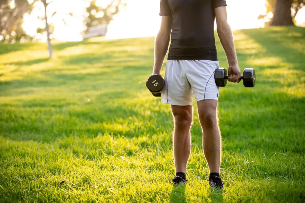 Man holding a dumbbell with each hands