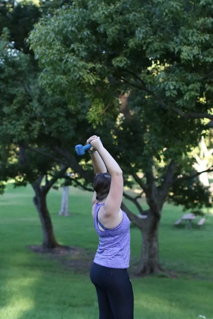 Woman lifting a dumbbell over her head