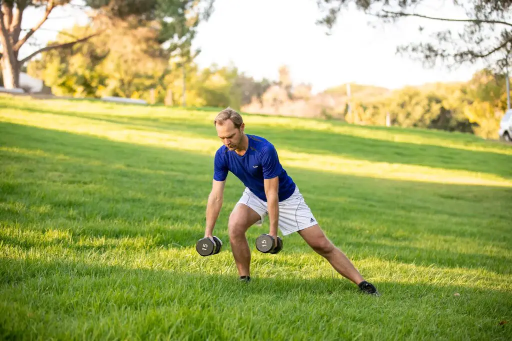 Man performing dumbbell exercises