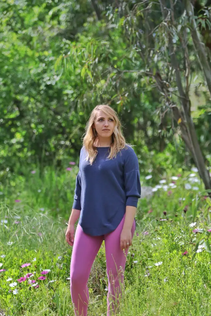 Woman standing in a grass field