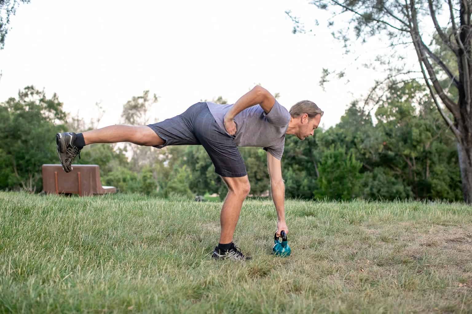 Man performing kettlebell exercises