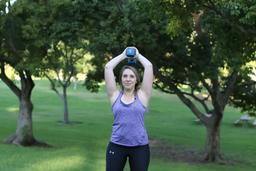 Woman lifting a dumbbell over her head