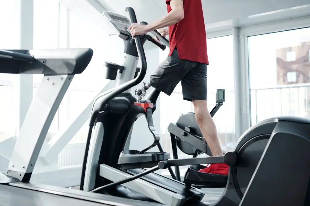 Man using an elliptical machine