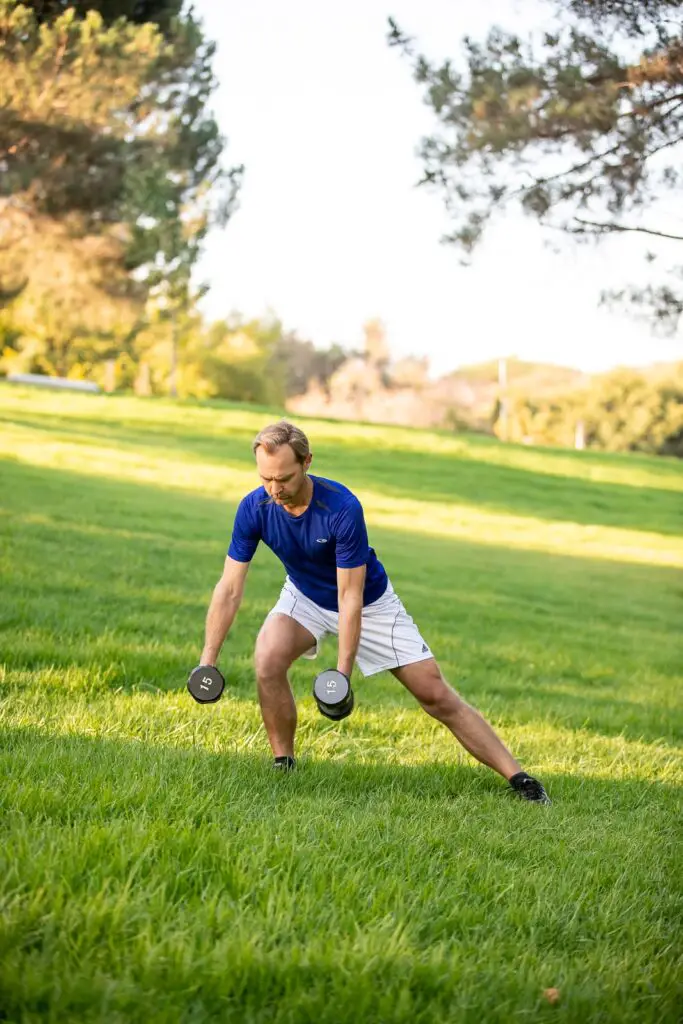 Man performing dumbbell exercises