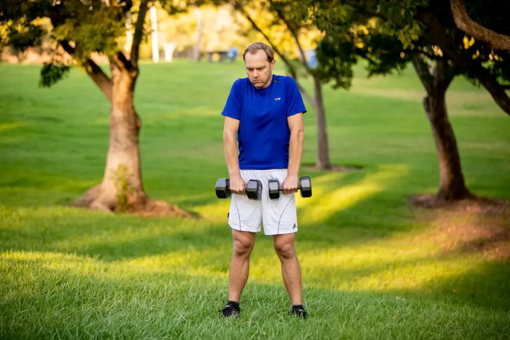 Man holding a dumbbell with each hands