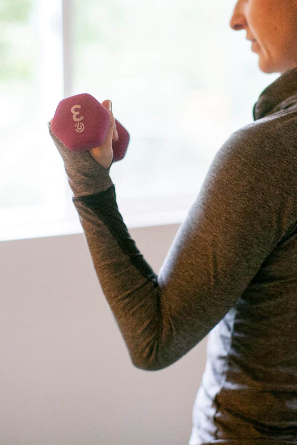 Woman lifting a dumbbell with one hand