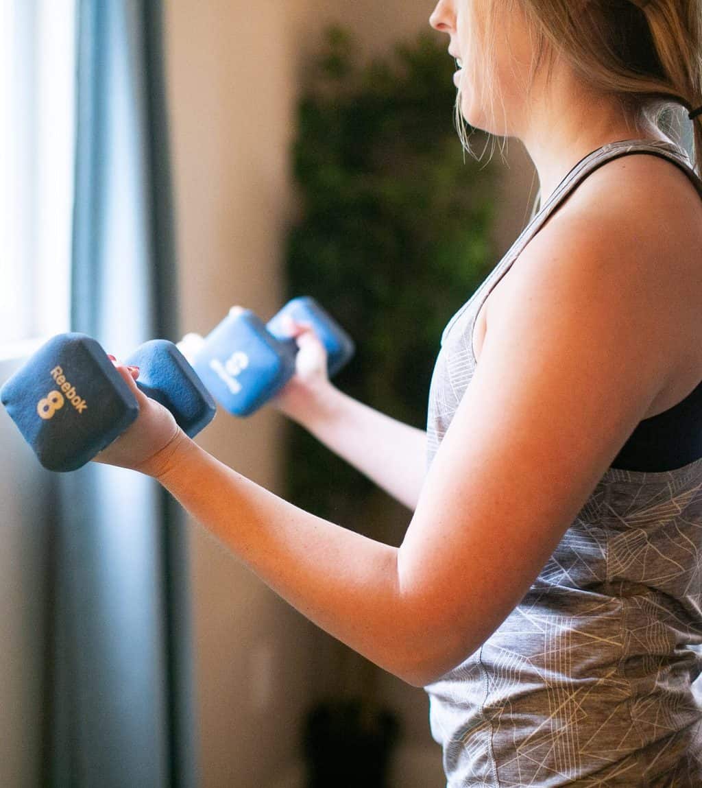 Woman lifting a pair of dumbbells