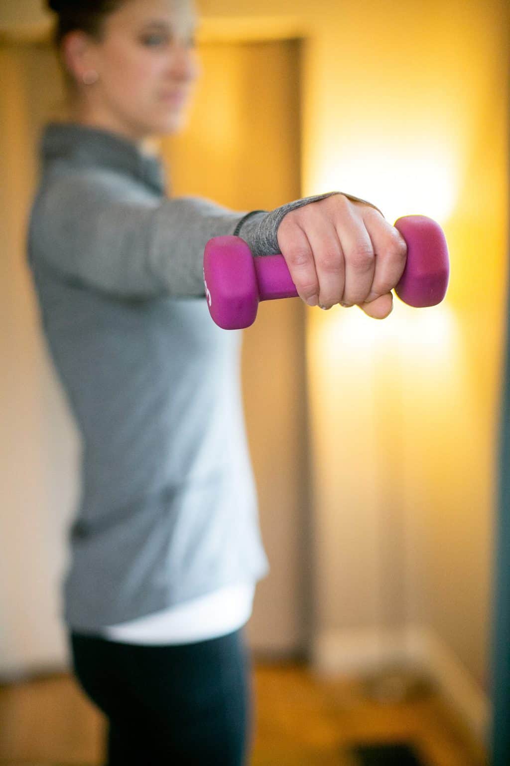 Woman doing a dumbbell side raise