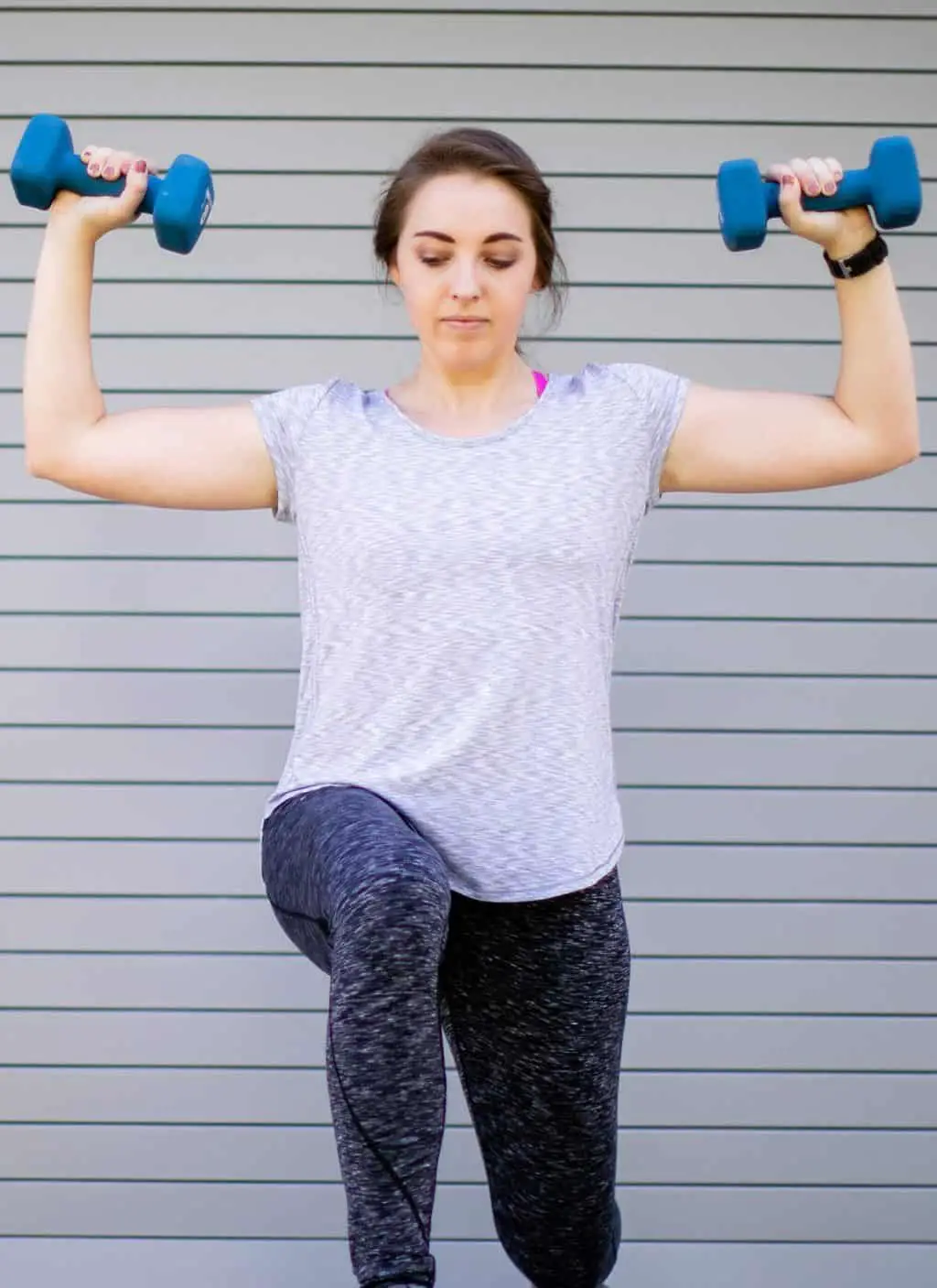 Woman doing dumbbell lunges