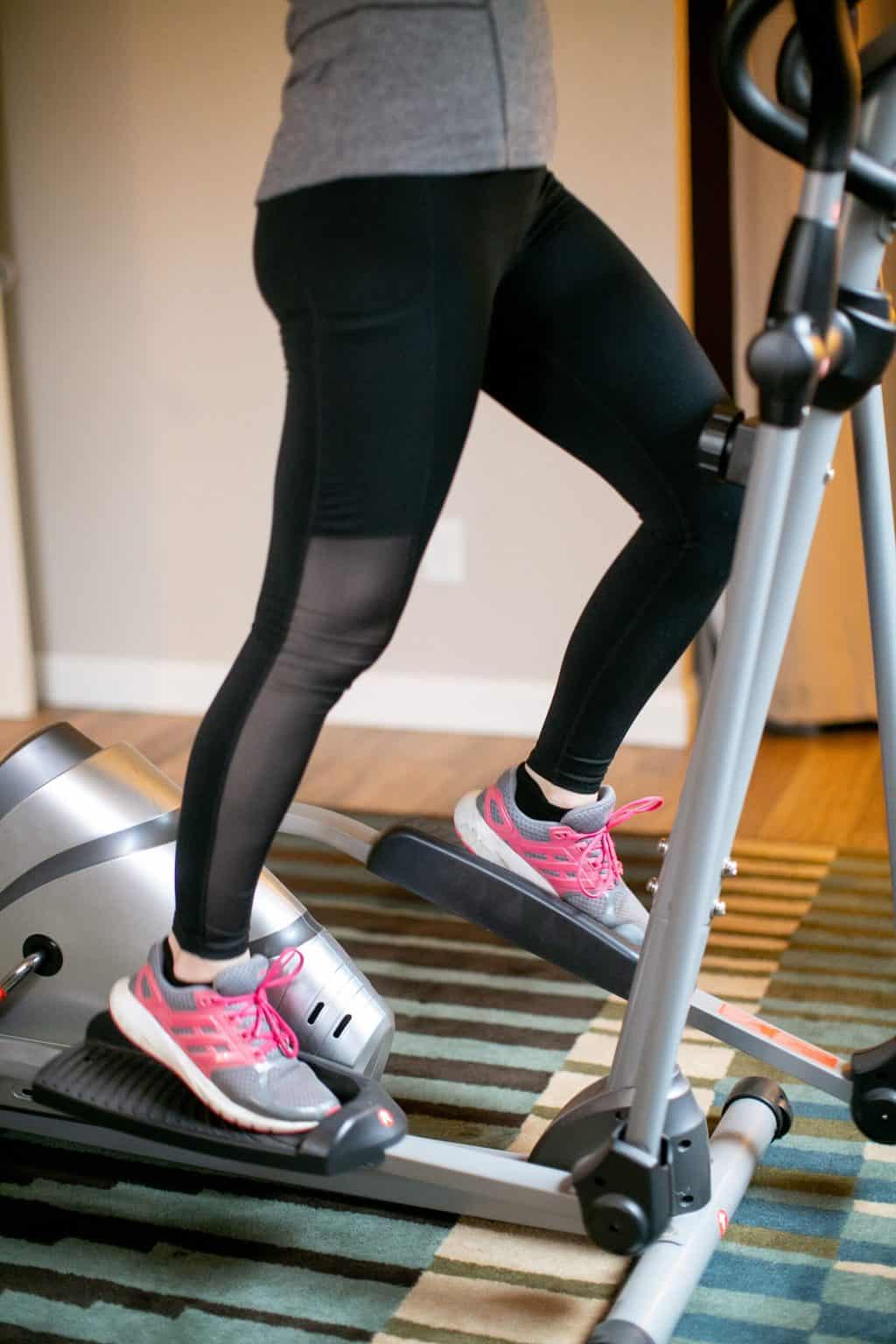 Woman using an elliptical machine